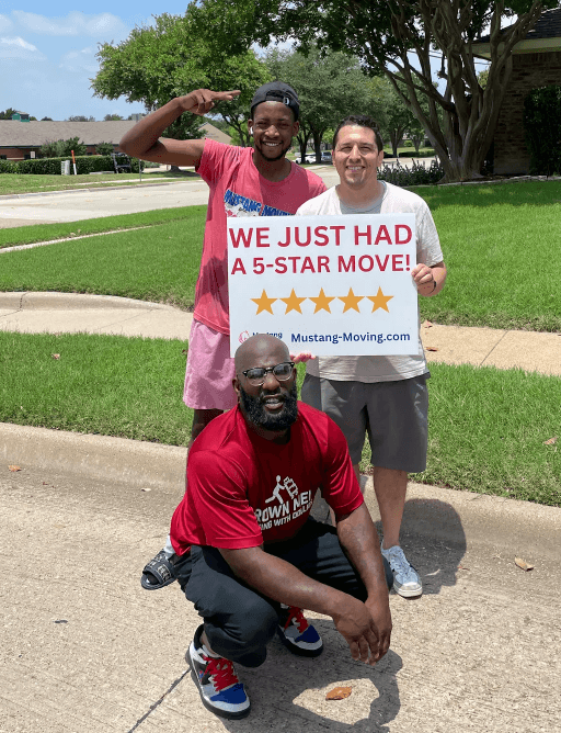Mustang Moving customer Devon M. with two crew members on a suburban sidewalk.