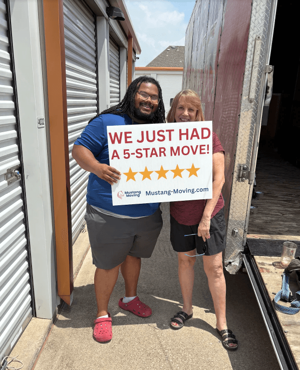 Mustang Moving customer Steven V. with a crew member at a self-storage facility.