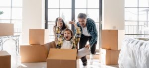 a family surrounded by boxes